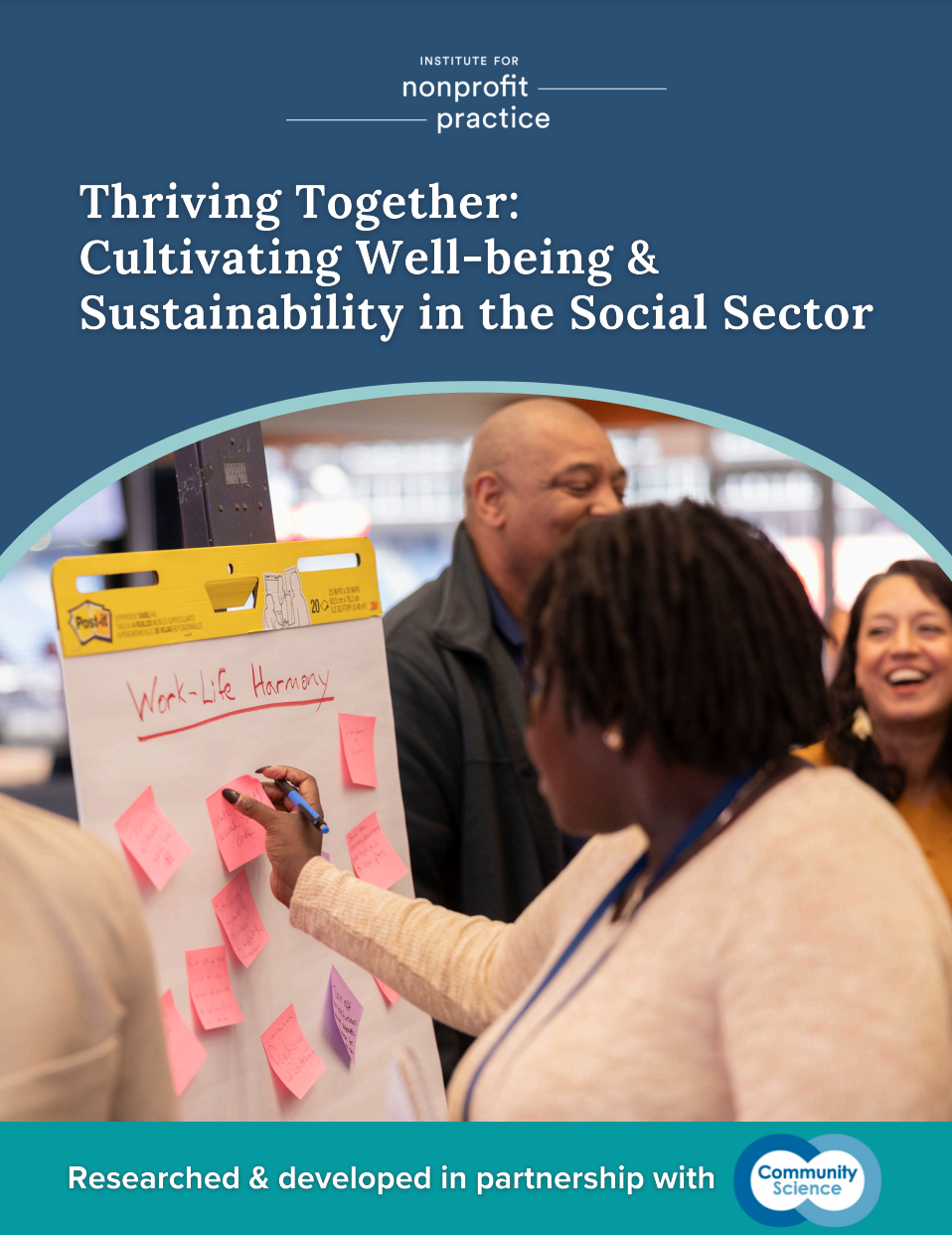 A woman writing on a flipchart labeled "Work-Life Harmony"